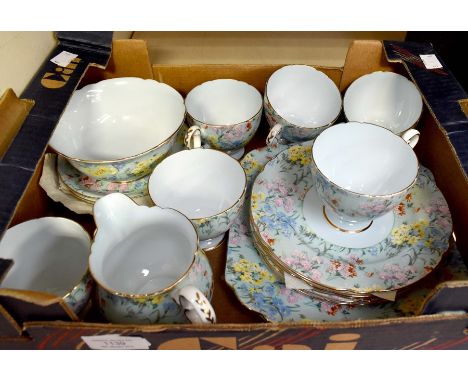 A Shelly 'Melody' part tea service comprising six cups, six saucers, six side plates, cake plate, milk jug and sugar bowl, ea