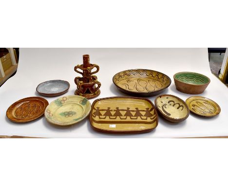 A collection of 19th Century slip ware including bowls, dishes, plates along with a candle holderCondition: Large oval dish h
