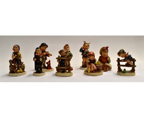 Nine Hummel figures of children in different poses