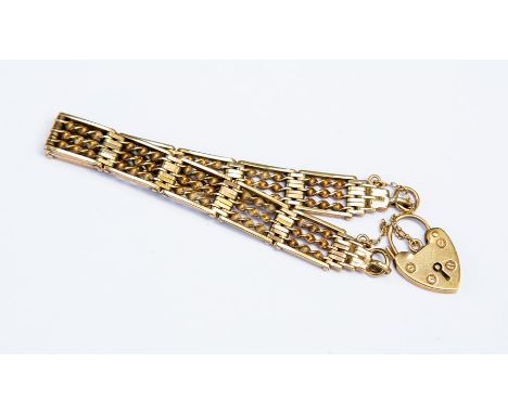 A 9ct yellow gold gate bracelet with fancy twist bars and padlock clasp, length approx. 17cm, total weight approx. 24gms