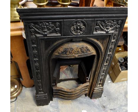 A cast iron bedroom fireplace, complete with fire back and grate