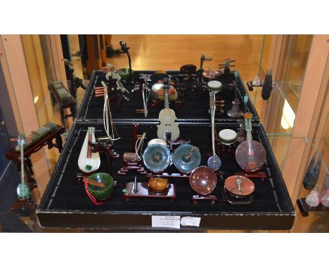 A collection of modern jade, carnelian and various carved stone musical instruments&nbsp;