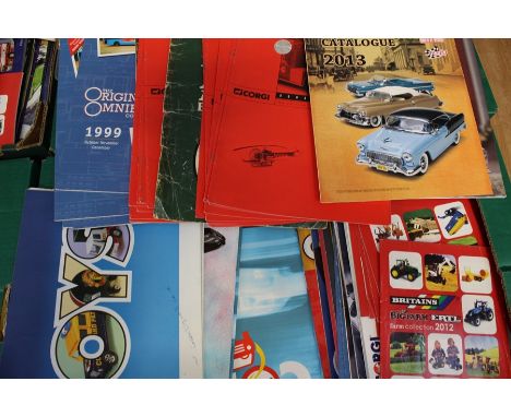 A quantity of assorted sales brochures including Corgi; EFE; Maisto; Sun Star and others. (one box)