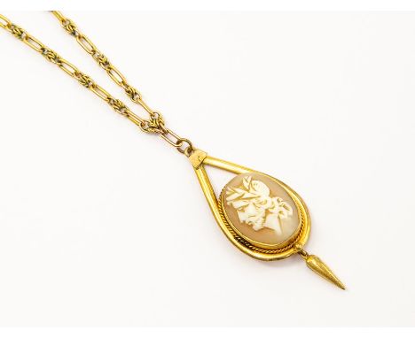A 19th century Etruscan style cameo pendant, the carved shell cameo depicting a male's portrait, in a gilt metal mount with t