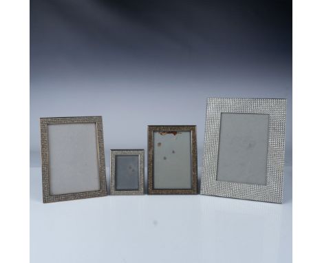 A set of four elegant picture frames featuring sparkling crystal trim, with two varying sizes. The frames are designed to hol