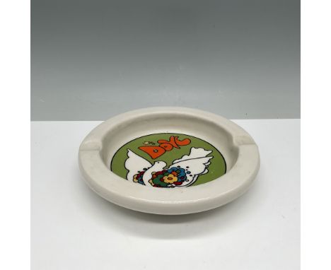 A vintage ceramic ashtray featuring the iconic Peace Dove artwork by celebrated pop artist Peter Max. The vibrant design show