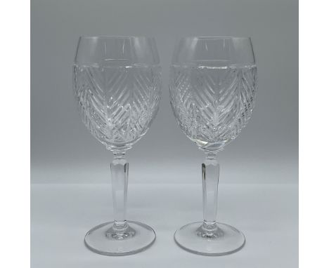 These elegant Ralph Lauren crystal goblets stand at 9" high and feature a stunning pattern of diagonal cuts that capture and 