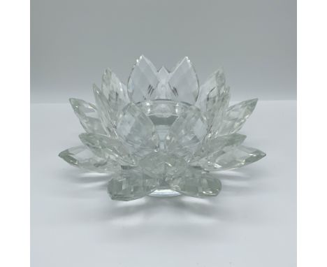 A striking crystal lotus candle holder designed with faceted petals that radiate brilliance from every angle. This intricatel