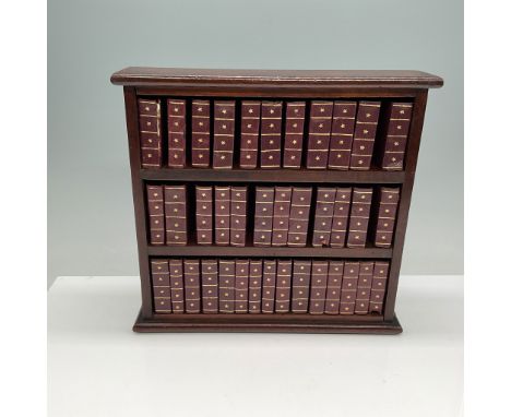 A collection of 38 miniature leather-bound books featuring the works of William Shakespeare, presented in a charming wooden d