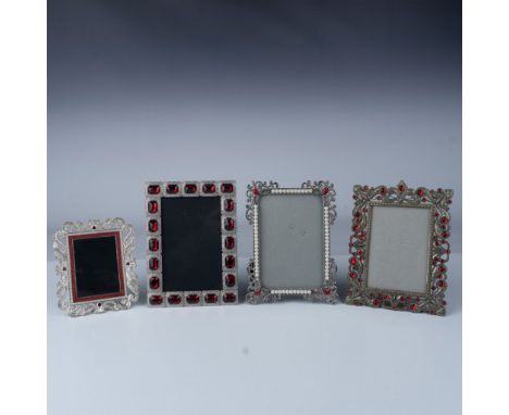 This lot includes four decorative picture frames, each featuring red crystal accents. One frame is enhanced with pearls along