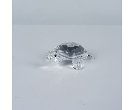 A stunning Swarovski crystal figurine featuring a detailed tortoise design. This piece exemplifies Swarovski's dedication to 