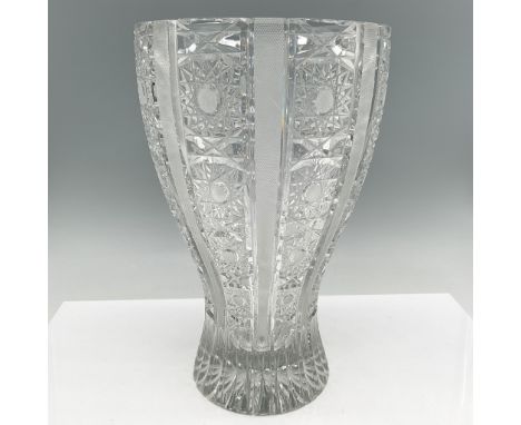 Elegant cut crystal vase featuring a detailed and symmetrical design, with alternating clear panels and intricate starburst a