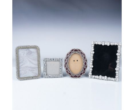 This set includes four decorative picture frames, each showcasing intricate designs. The frames are adorned with sparkling rh