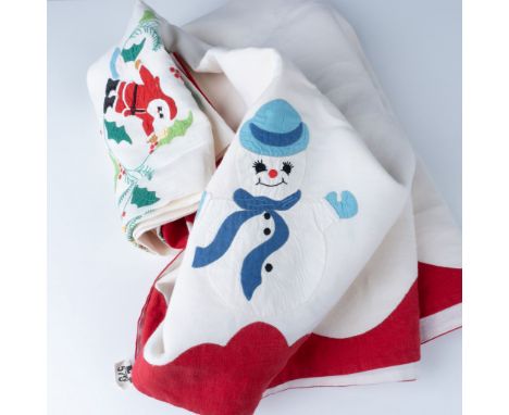 Charming holiday tablecloth featuring festive applique and embroidery of Santa Claus, a snowman, holly, and Christmas ornamen
