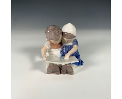 This charming B&amp;G porcelain figurine, titled "Children Reading Together," captures a heartwarming scene of two children s