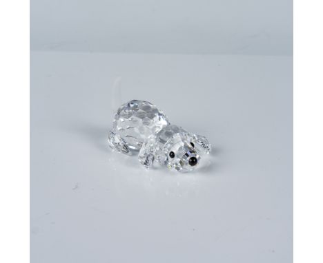Crafted with precision-cut crystal to showcase the brand's signature sparkle. The playful pose captures lifelike charm, with 