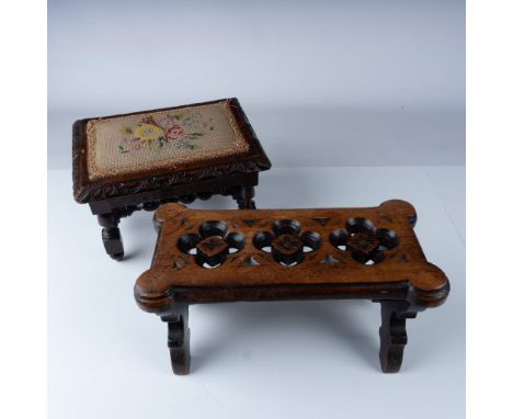 This set includes two carved wooden footstools designed for children, each showcasing intricate craftsmanship. The first stoo