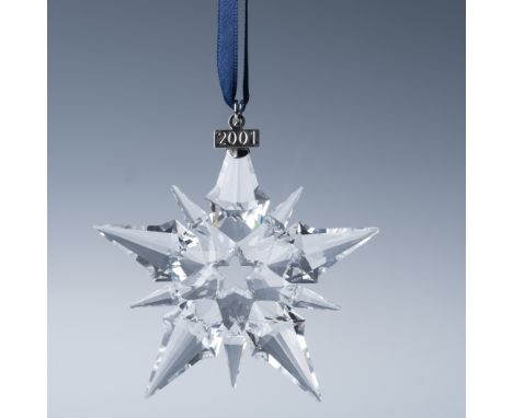 This is an authentic Swarovski 2001 Annual Edition Christmas Ornament. Crafted in Austria, this stunning crystal star ornamen