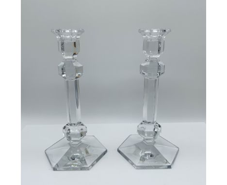 Elegant pair of Val Saint Lambert crystal candlesticks featuring a striking geometric design with faceted accents and a hexag
