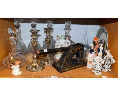 Assorted items including a pair of silver plated candlesticks, five glass decanters, Staffordshire flat-backs, Continental fi