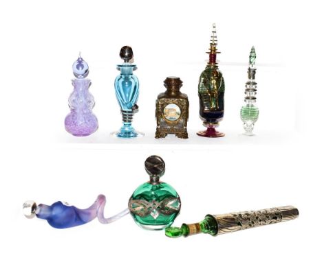 A Victorian silver mounted glass scent bottle, hallmark for Birmingham 1900, a brass mounted glass scent bottle applied with 