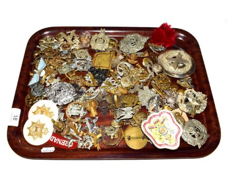 A tray of assorted military cap badges etc including King's own Scottish Borderers, Argyl &amp; Sutherland, Tynesdide Scottis