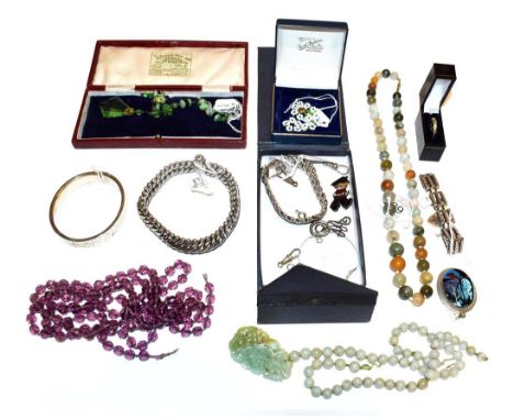 A quantity of costume jewellery including a silver gatelink bracelet, fastenings, an amethyst faceted bead necklace (a.f.), a