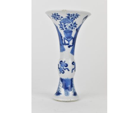 A Chinese Kangxi porcelain blue and white gu vase decorated with two women standing either side of jardiniere and stand, a ba