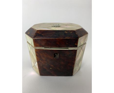 A Mid 19th century mother of peal and tortoiseshell tea caddy of octagonal form, the hinged lid enclosing a cover, 9cm h x 11