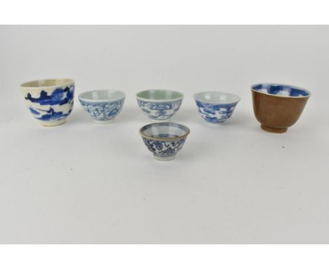 Six Chinese Qing dynasty blue and white tea bowls, 19th/20th century, four decorated with flowers, one with a continuous rive