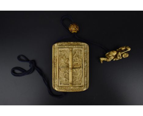 A Japanese Meiji period ivory inro shaped travelling shrine with hanging carved ivory ojime and figural netsuke, shrine with 