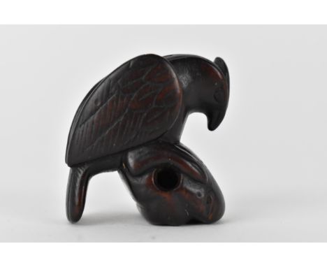 A Japanese Edo period, 18th century wooden netsuke of a bird on a rock, 4cm h 