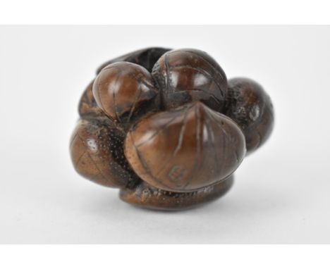 A Japanese Edo period 18th/19th century wooden netsuke of a cluster of seashells 