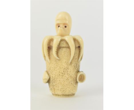 A Japanese Meiji period, late 19th century ivory netsuke of an octopus in a basket with an articulated head and two shells at
