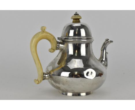 A Victorian London silver teapot by Robert Garrard, dated 1857, with ivory handle and finial, 731g (various dents) 