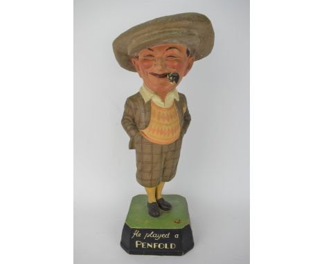 An early/mid 20th century shop advertising point of sale display figural stand of 'The Penfold Man' advertising golf balls, t