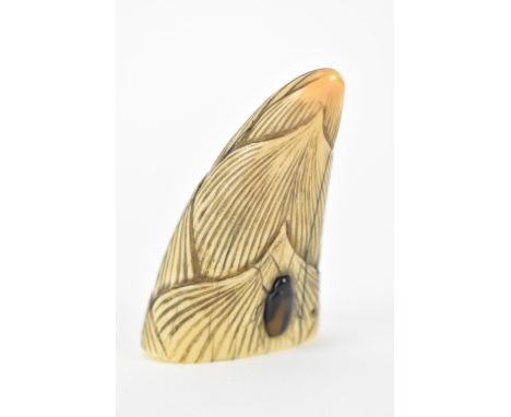A Chinese Qing dynasty ivory netsuke, 19th century, a beetle climbing up a bamboo shoot, 7.5cm h 