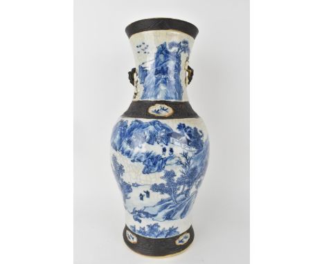 A large Chinese Quin dynasty Nanjing blue and white crackle glazed vase with a continuous river landscape, buildings, boats, 