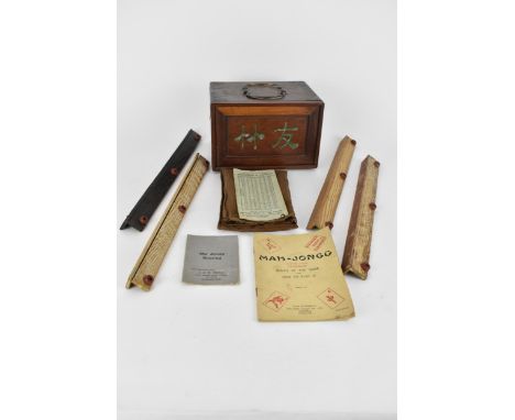 An early 20th century Chinese bamboo and bone Mah Jong set comprising of one hundred and forty eight tablets, eighty seven st