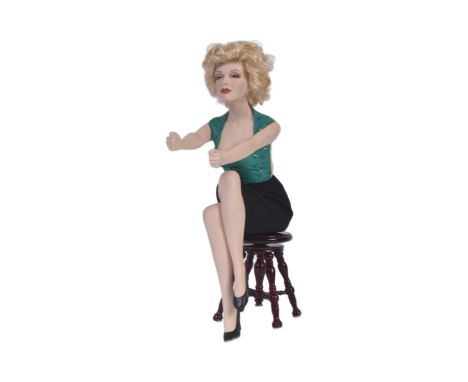 An original Franklin Mint hand painted Marilyn Monroe porcelain doll figurine ' Unforgettable Marilyn '. The figure dressed i