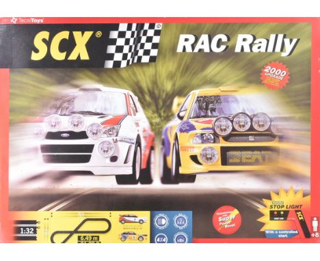 A Spanish made ( Tecni Toys ) Scalextric style slot car racing set RAC Rally. The set containing x2 rally cars ( Ford Focus a