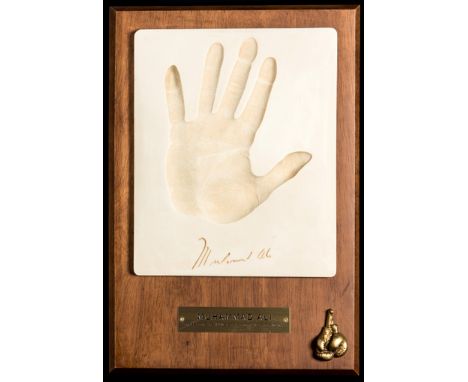 A Limited Edition Muhammad Ali hand print collectible plaque. Hand finished piece in solid wood with a brass nameplate.