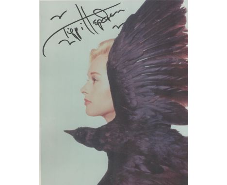 Tippi Hedren signed 10x8 colour photo star from the iconic Hitchcock movie 'The Birds' picture in profile behind a large blac