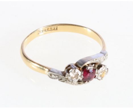 18ct yellow gold and platinum ruby and diamond ring in a crossover setting, size O , 2.58g