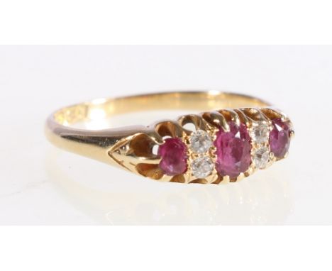 18ct yellow gold diamond and ruby set dress ring, 3.3g, ring size R.