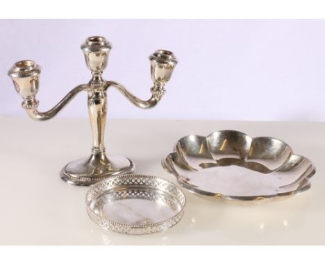 Wilkens 800 grade silver lobed dish 223g, Dutch grade two silver coaster 82g and a three branch candlestick.