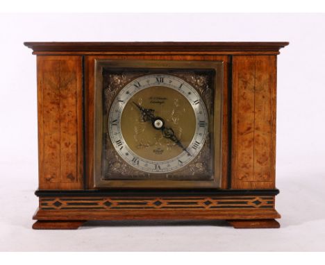 Elliot mantle clock in burr wood case retailed by Christie of Edinburgh, 21cm wide.