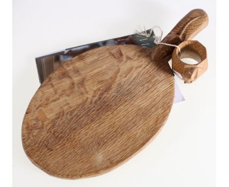 Robert Mouseman Thompson bread board, 38cm long and a napkin ring