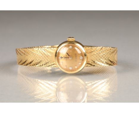 Ladies Omega 18 carat gold automatic wrist watch, with 18 carat gold Omega strap gold coloured dial with diamond set hour mar
