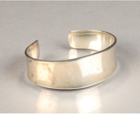 Georg Jensen, a Danish modernist sterling silver torque bangle of slightly concave form, model No 188, boxed,weight 51g